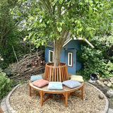 hum outdoorkissen 40x40 auf einer bank draußen im Garten